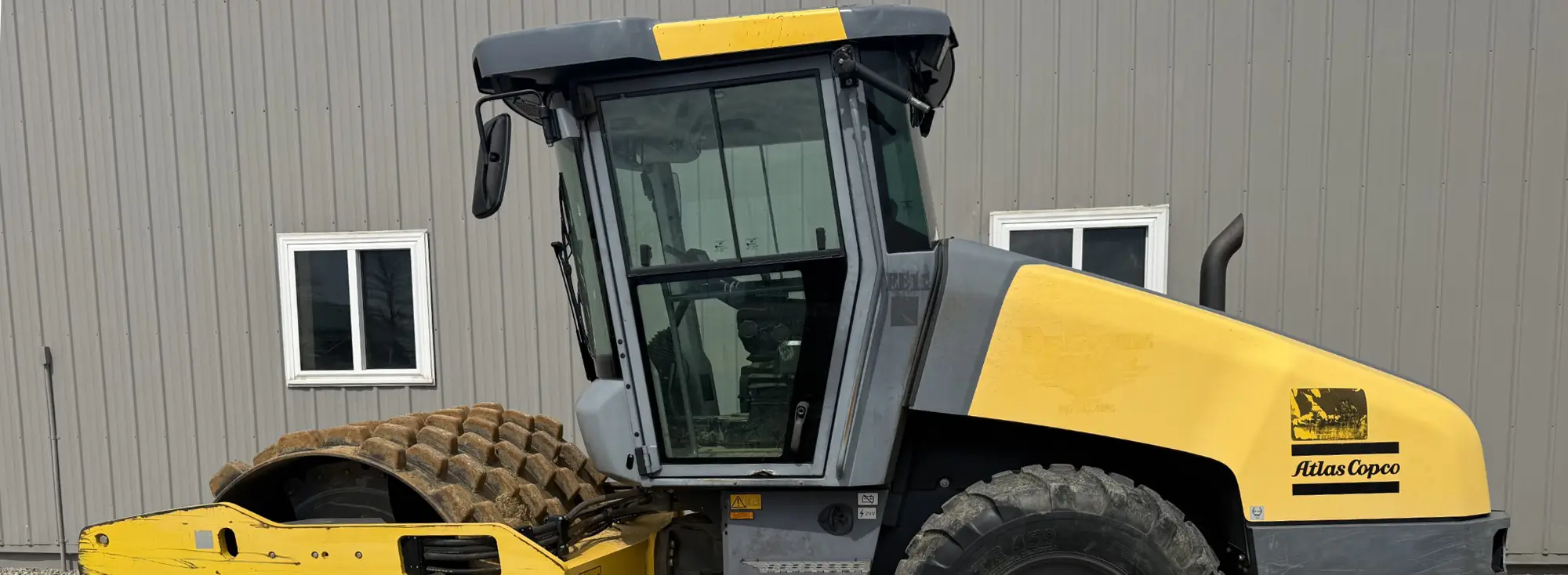Yellow Atlas Copco single-drum compactor